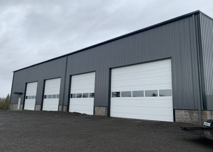Four commercial overhead garage doors